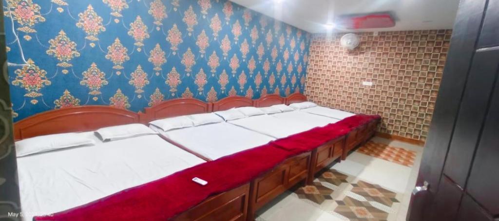 Postel nebo postele na pokoji v ubytování Hotel Parinay Vatika Deoghar