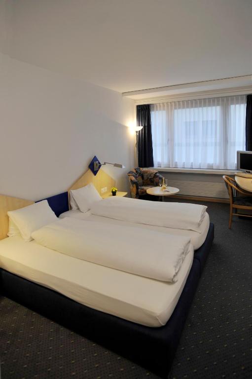 Postel nebo postele na pokoji v ubytování Hotel Blumenstein Self-Check In