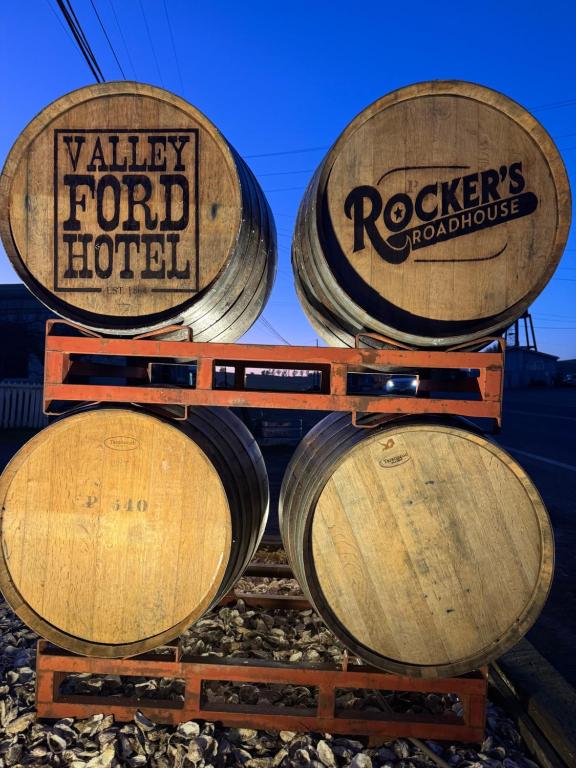 a group of wine barrels stacked on top of each other at Valley Ford Hotel in Valley Ford