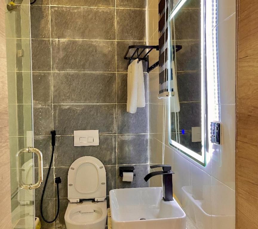 Koupelna v ubytování Lisa Suites Apart-Hotel