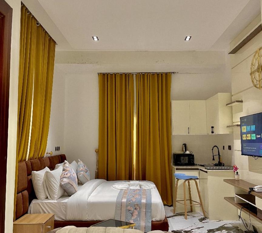 Postel nebo postele na pokoji v ubytování Lisa Suites Apart-Hotel