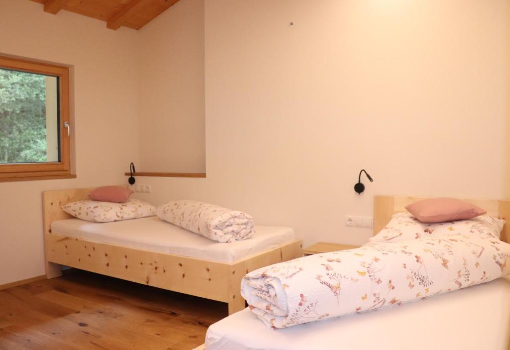 A bed or beds in a room at Schneiderhof