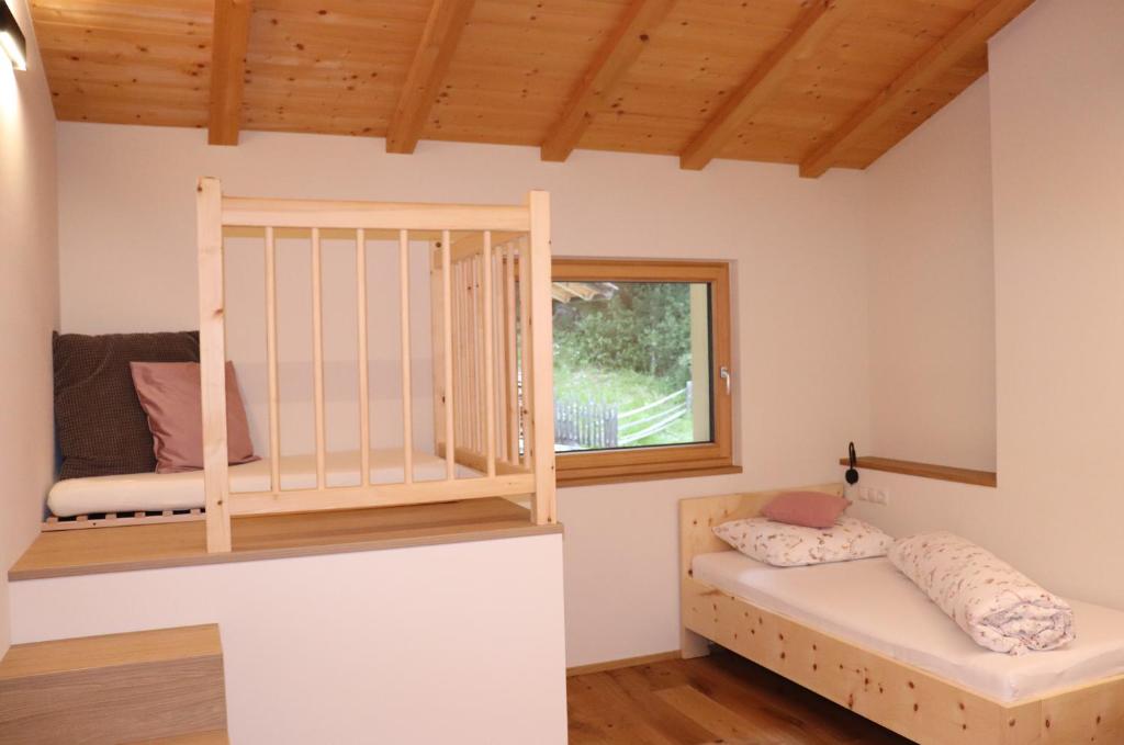 A bed or beds in a room at Schneiderhof
