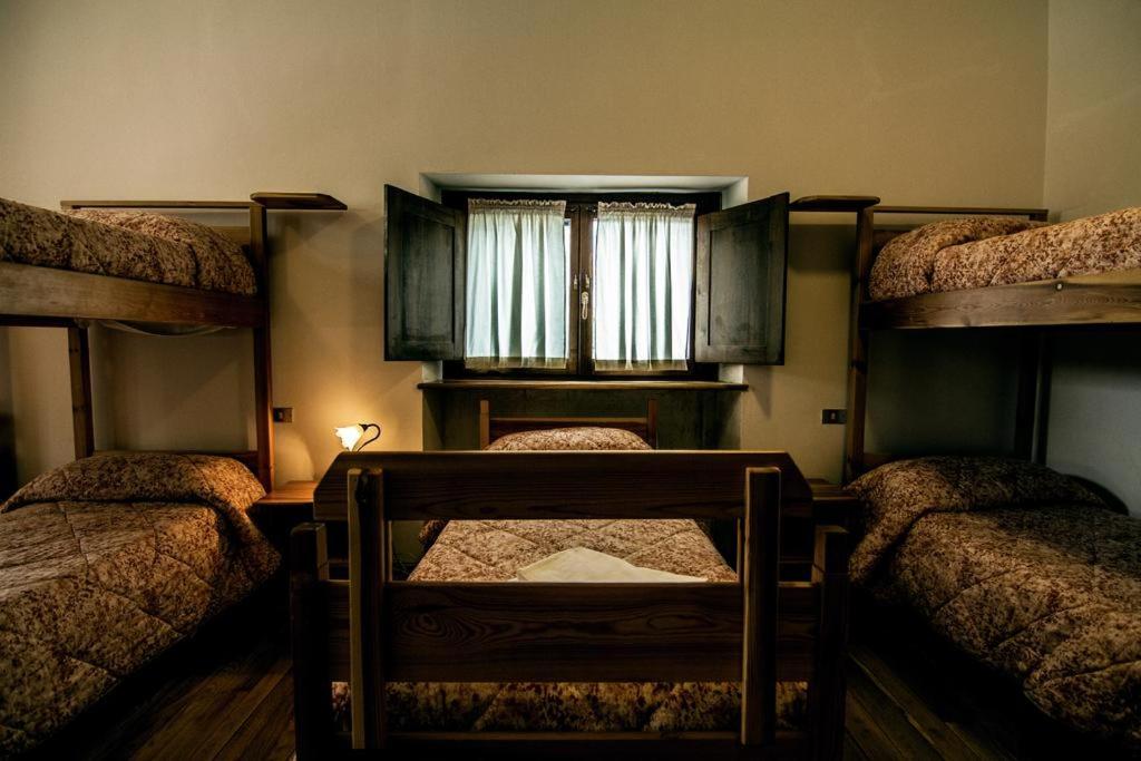 Postel nebo postele na pokoji v ubytování Lo Chalet di Rovere