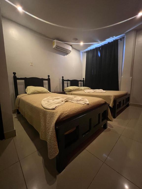 Postel nebo postele na pokoji v ubytování Hotel LC