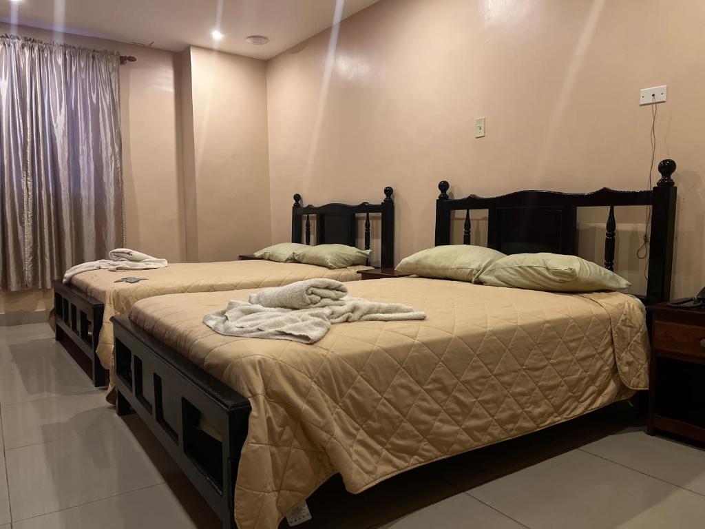 Postel nebo postele na pokoji v ubytování Hotel LC