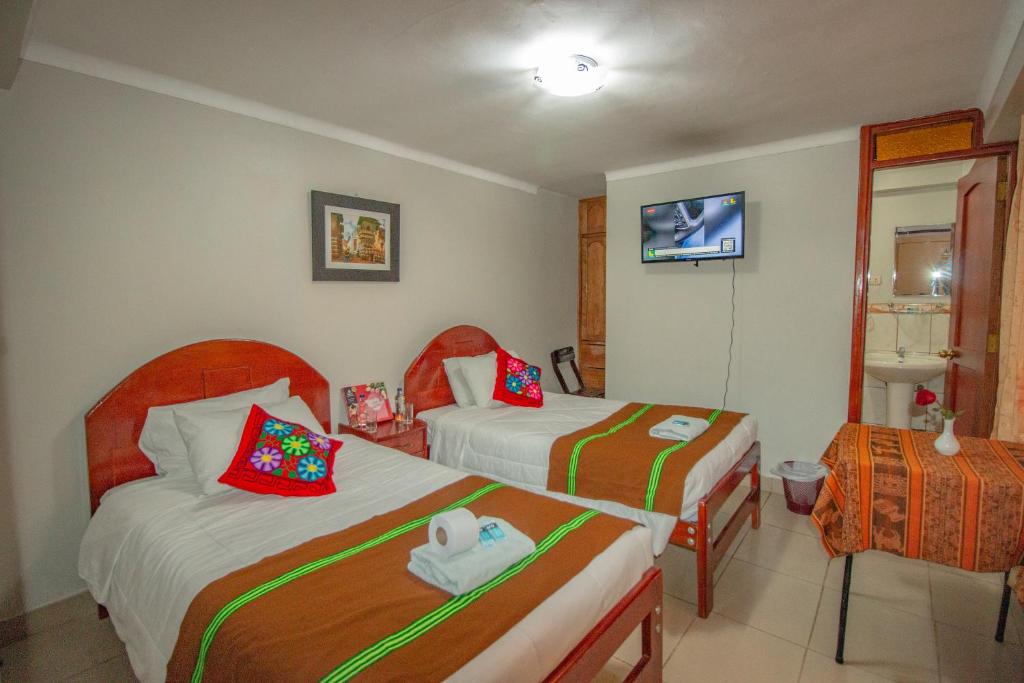 Postel nebo postele na pokoji v ubytování AloInkaHotels