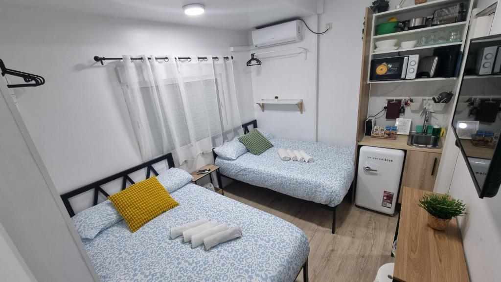 A bed or beds in a room at Mini Estudio Lovely Chueca