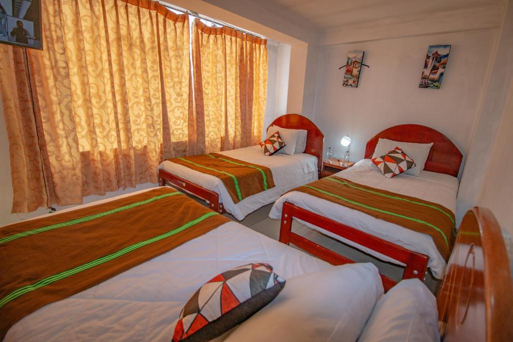 Postel nebo postele na pokoji v ubytování AloInkaHotels