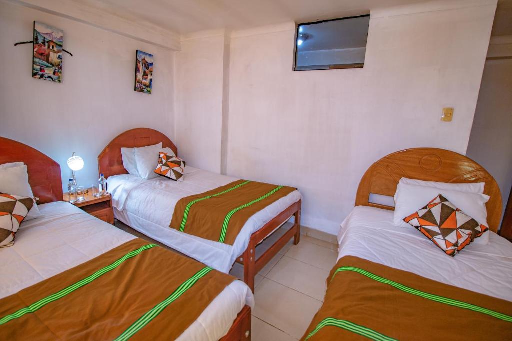 Postel nebo postele na pokoji v ubytování AloInkaHotels