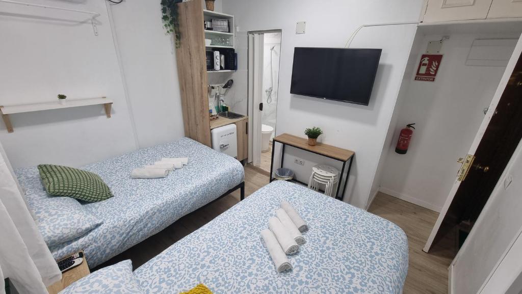 A bed or beds in a room at Mini Estudio Lovely Chueca