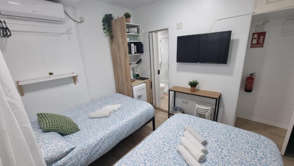 A bed or beds in a room at Mini Estudio Lovely Chueca
