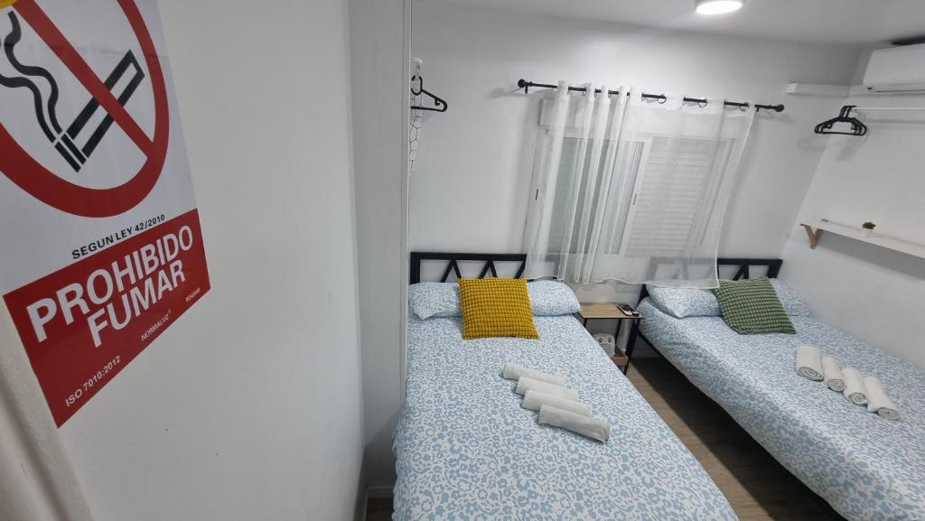 A bed or beds in a room at Mini Estudio Lovely Chueca