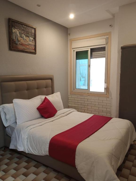 Ένα ή περισσότερα κρεβάτια σε δωμάτιο στο Hotel Astoria Tanger