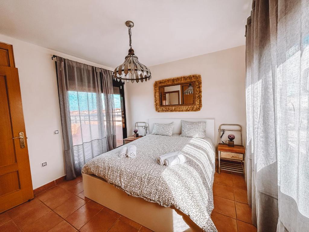 Ένα ή περισσότερα κρεβάτια σε δωμάτιο στο Casa Bejeques