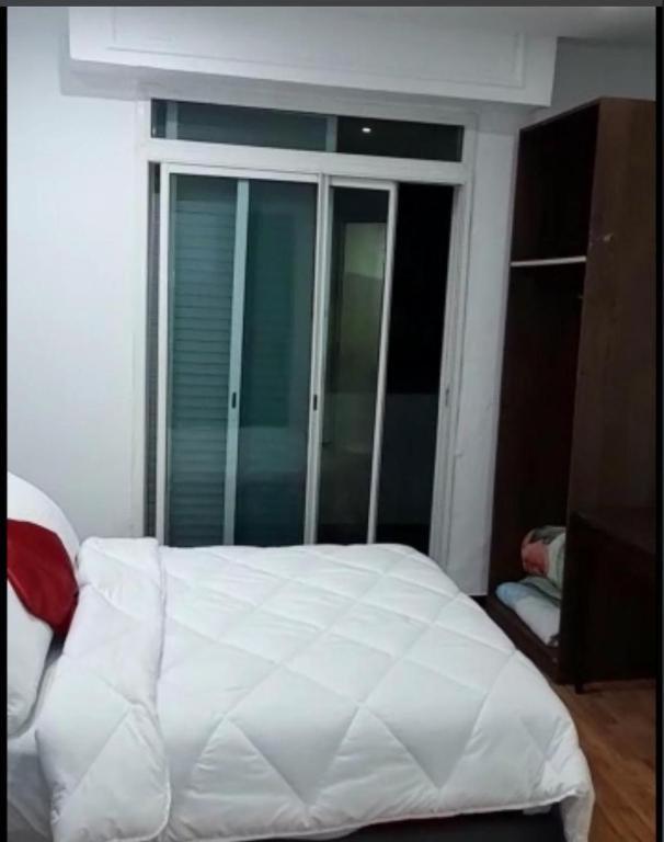 Ένα ή περισσότερα κρεβάτια σε δωμάτιο στο Hotel Astoria Tanger