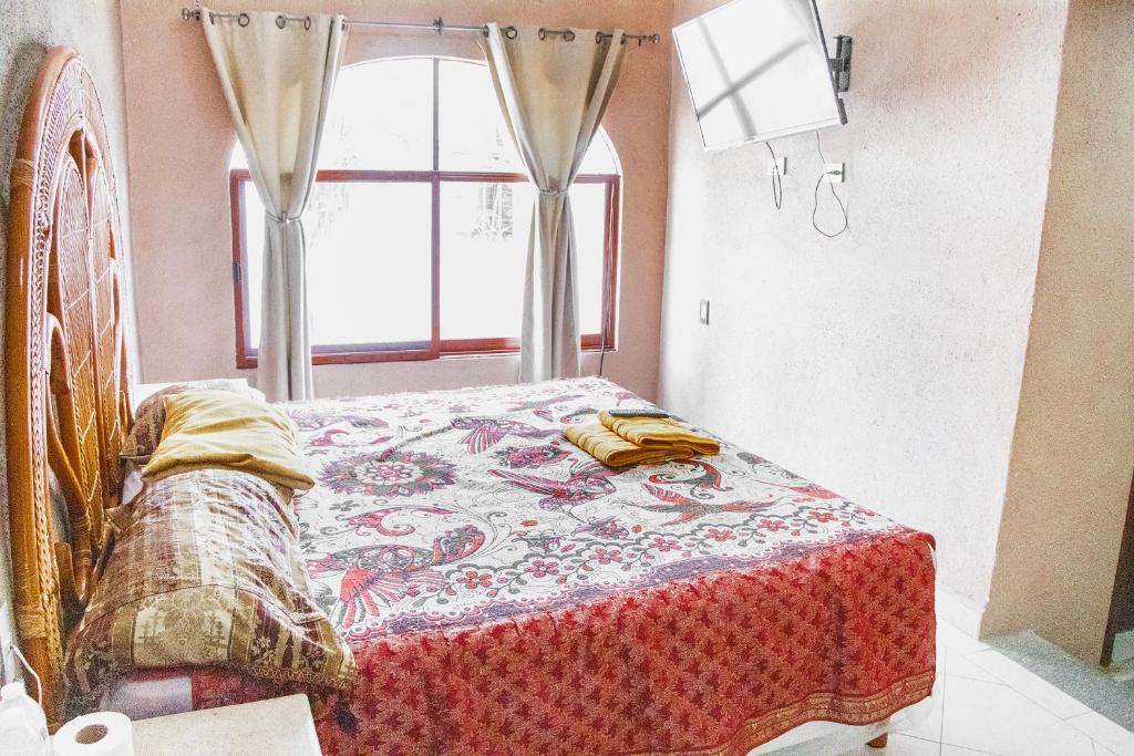 Postel nebo postele na pokoji v ubytování CORAZÓN DE TEPOZ