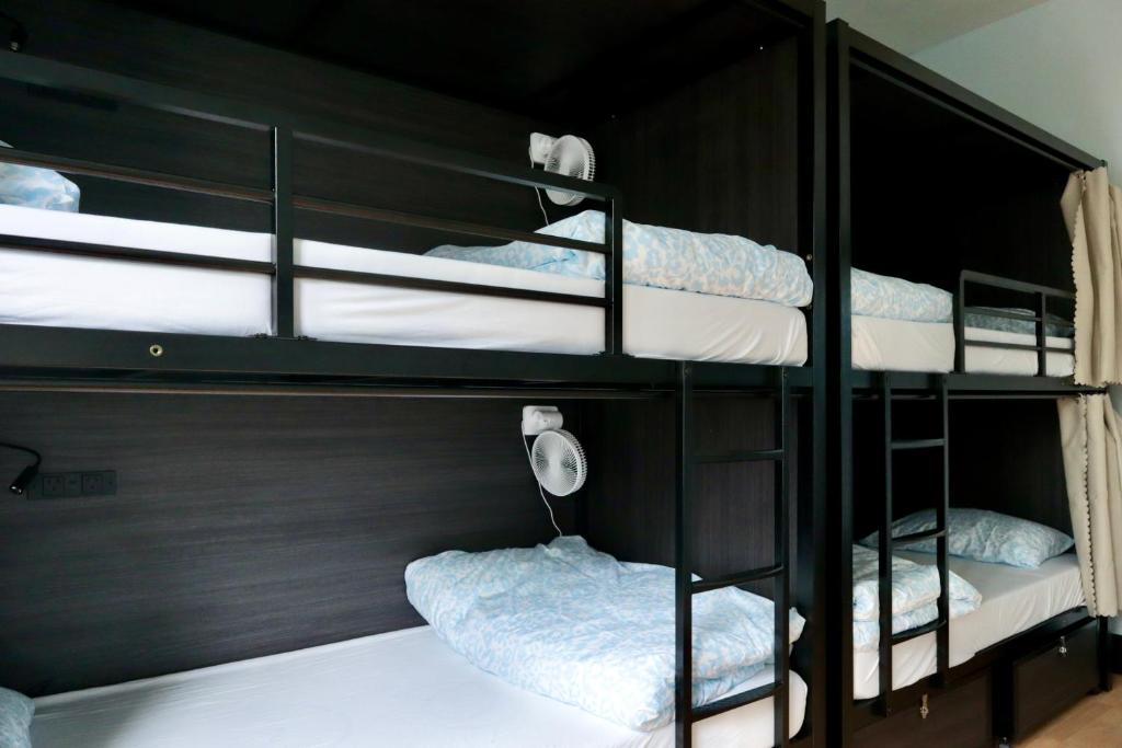 Postel nebo postele na pokoji v ubytování Ritz For Backpackers
