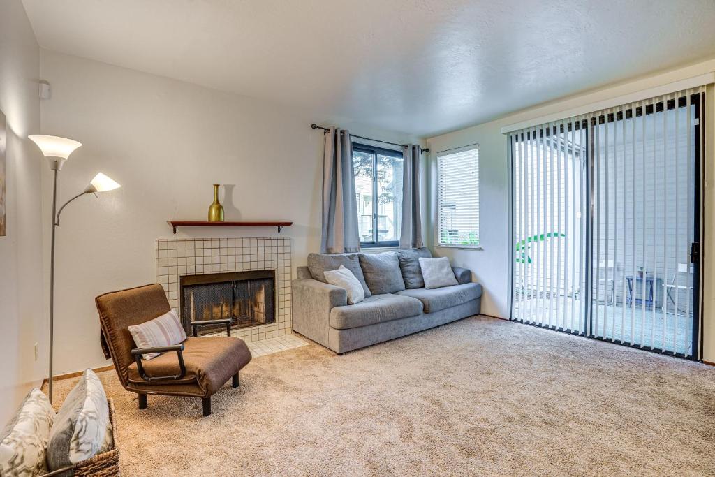 a living room with a couch and a fireplace at Stay and Play Bay Area Condo with Community Pool! in Richmond