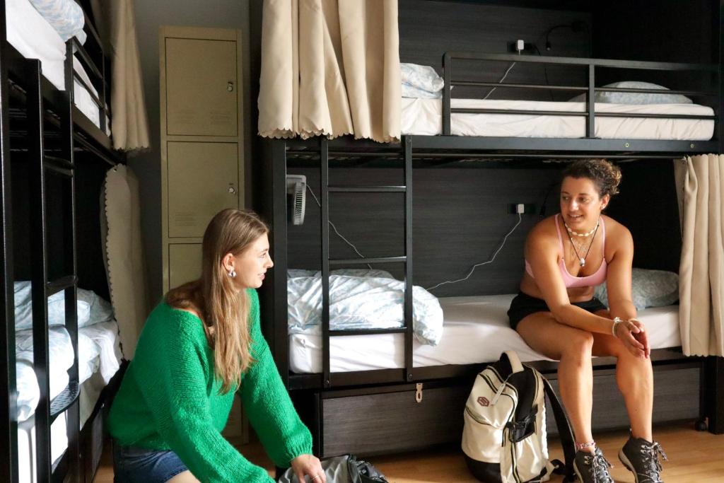 Postel nebo postele na pokoji v ubytování Ritz For Backpackers