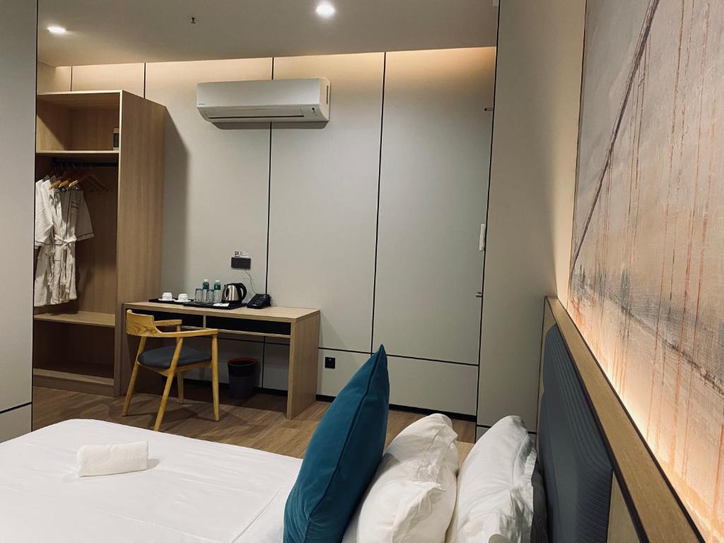 Postel nebo postele na pokoji v ubytování Fan's Hotel Palo