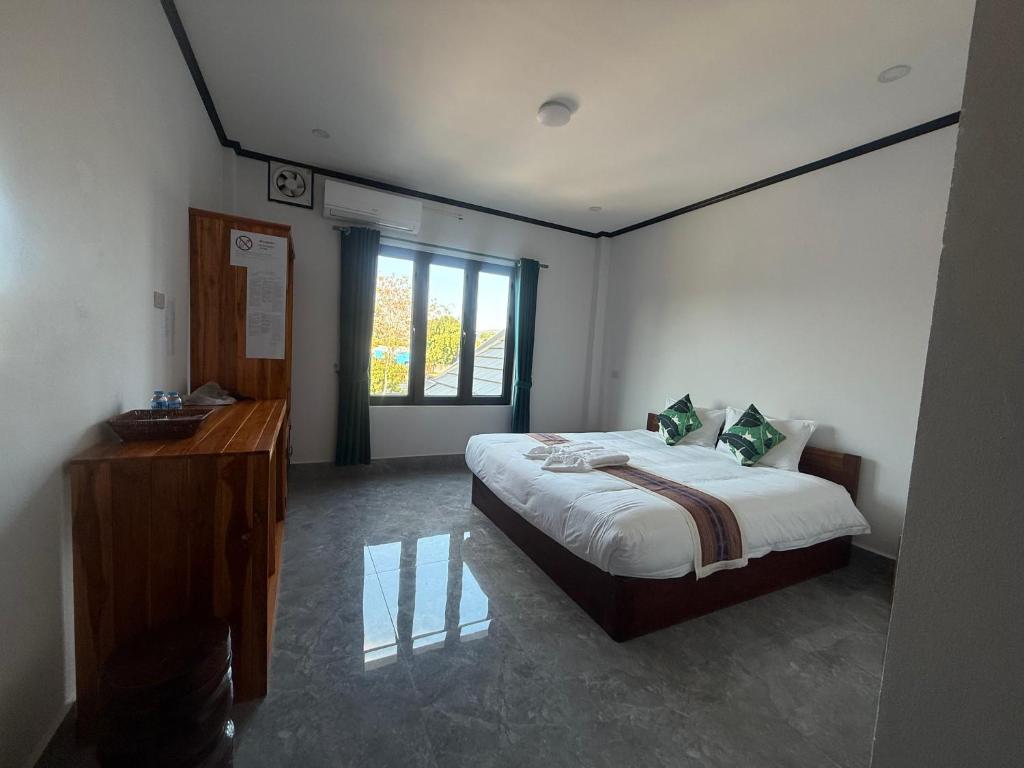 Postel nebo postele na pokoji v ubytování MANYTHIP Hotel