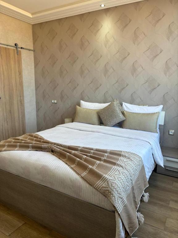 Postel nebo postele na pokoji v ubytování Riad L'Aéroport