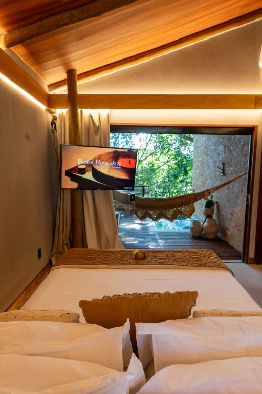 Postel nebo postele na pokoji v ubytování SITIO VILLA DA MATA