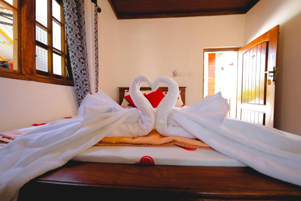 Postel nebo postele na pokoji v ubytování Inpan's beach resort Batticaloa