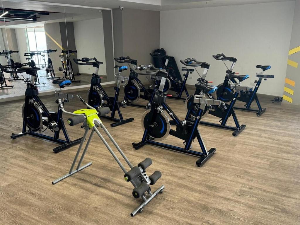 a room with a bunch of exercise bikes in it at Luxury Apartment Jacuzzi Air Conditioning Fireplace and King Bed in Medellín