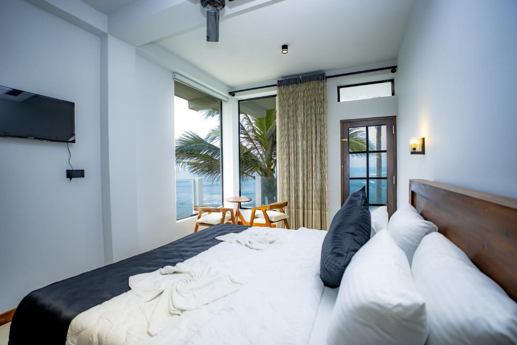 Postel nebo postele na pokoji v ubytování Secret Bay Resort Weligama