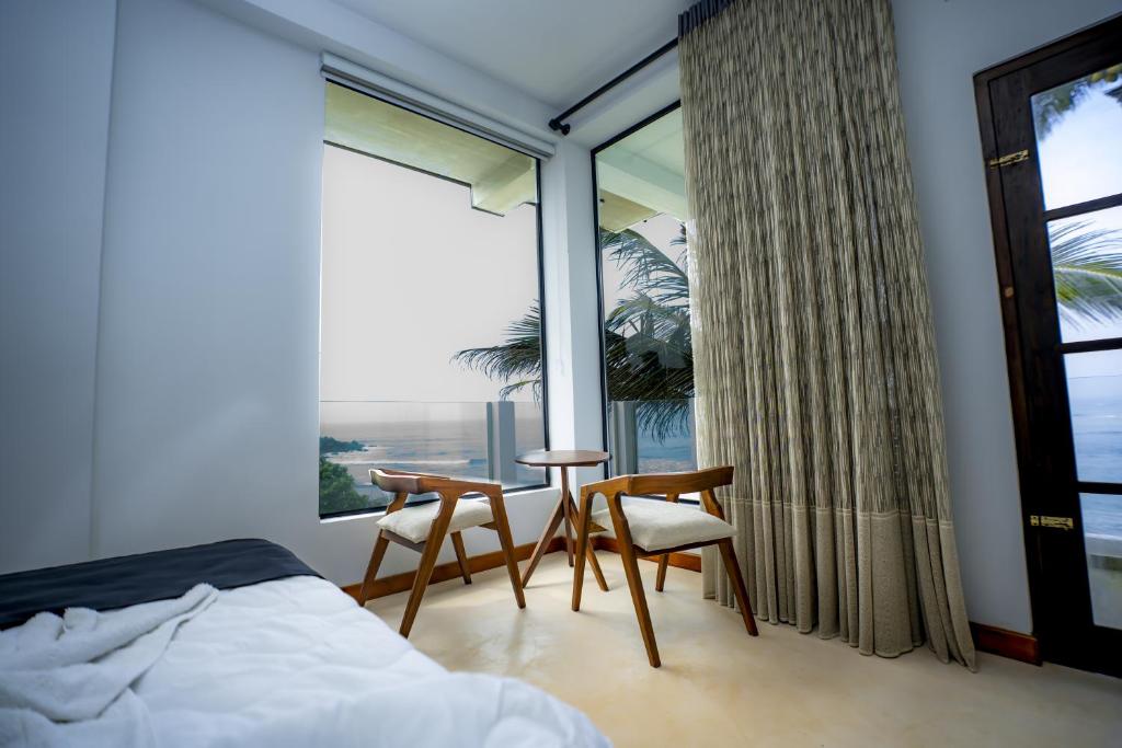 Postel nebo postele na pokoji v ubytování Secret Bay Resort Weligama