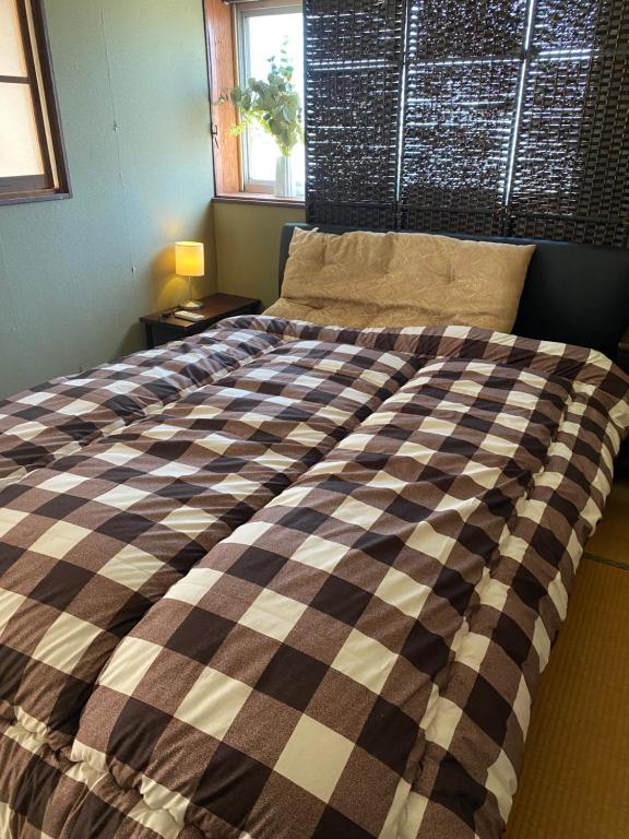 Postel nebo postele na pokoji v ubytování One room Pusang Gala Yuki City