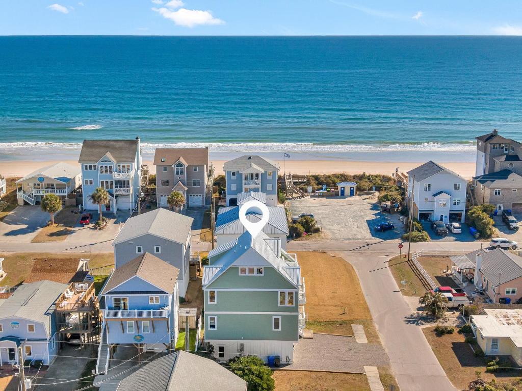 an aerial view of houses and the beach at Shore Sounds Fun in Surf City