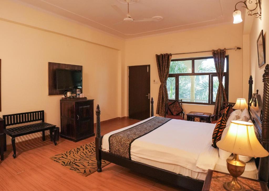 Uma cama ou camas num quarto em Raj Palace Resort