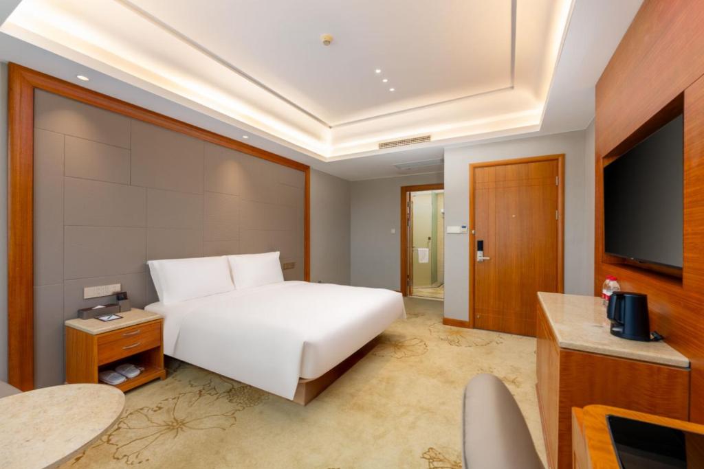 TV a/nebo společenská místnost v ubytování 上海戴斯温德姆酒店 Shanghai Days Wyndham Hotel
