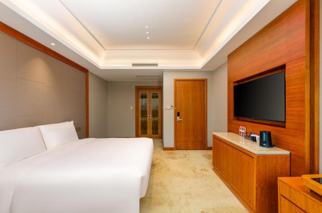 TV a/nebo společenská místnost v ubytování 上海戴斯温德姆酒店 Shanghai Days Wyndham Hotel