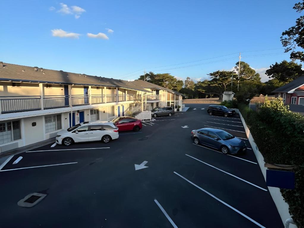 a group of cars parked in a parking lot at Inn By the Bay Monterey in Monterey
