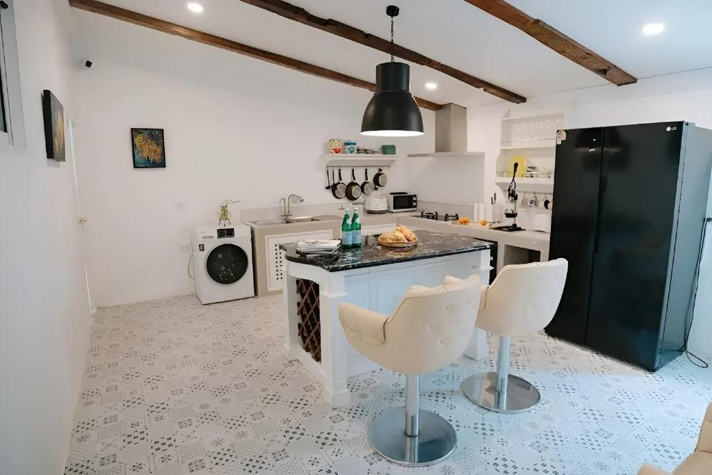 Kuchyň nebo kuchyňský kout v ubytování Villa Cavallo Chiangrai