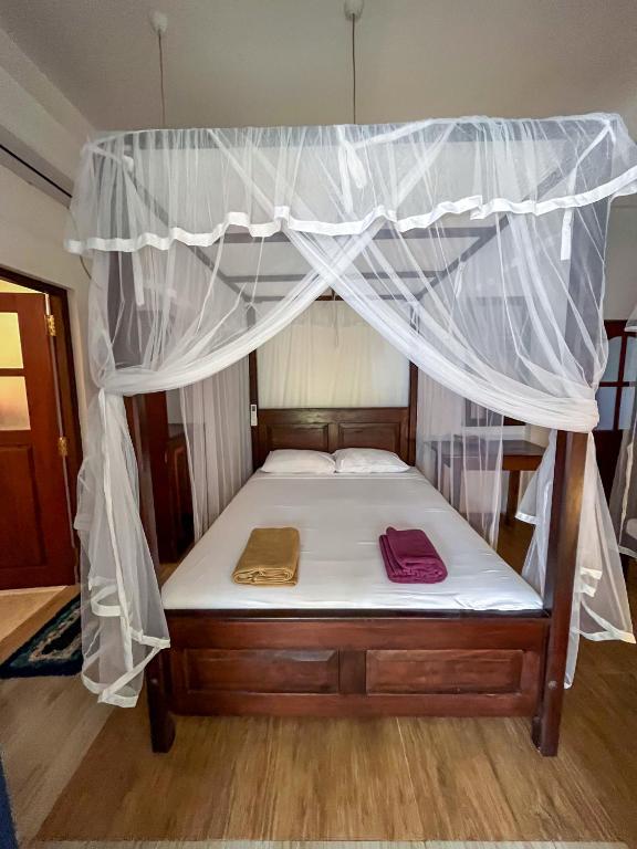 Letto o letti in una camera di Abraham Beach House