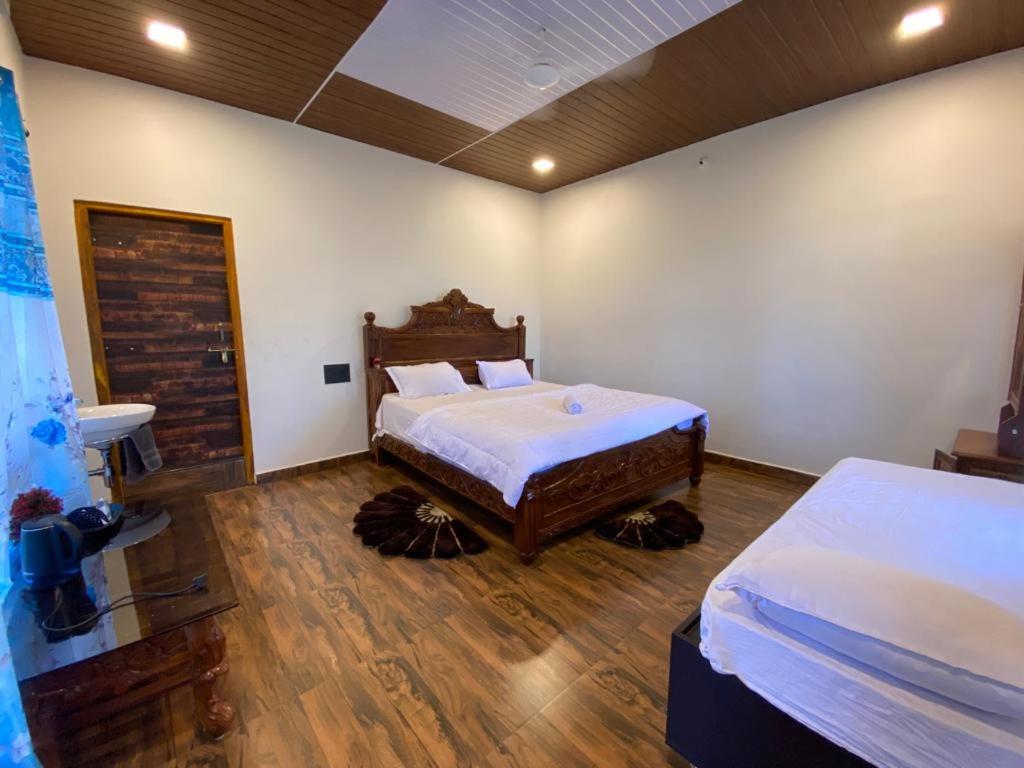 Voodi või voodid majutusasutuse Hampi Shukra Guest House toas