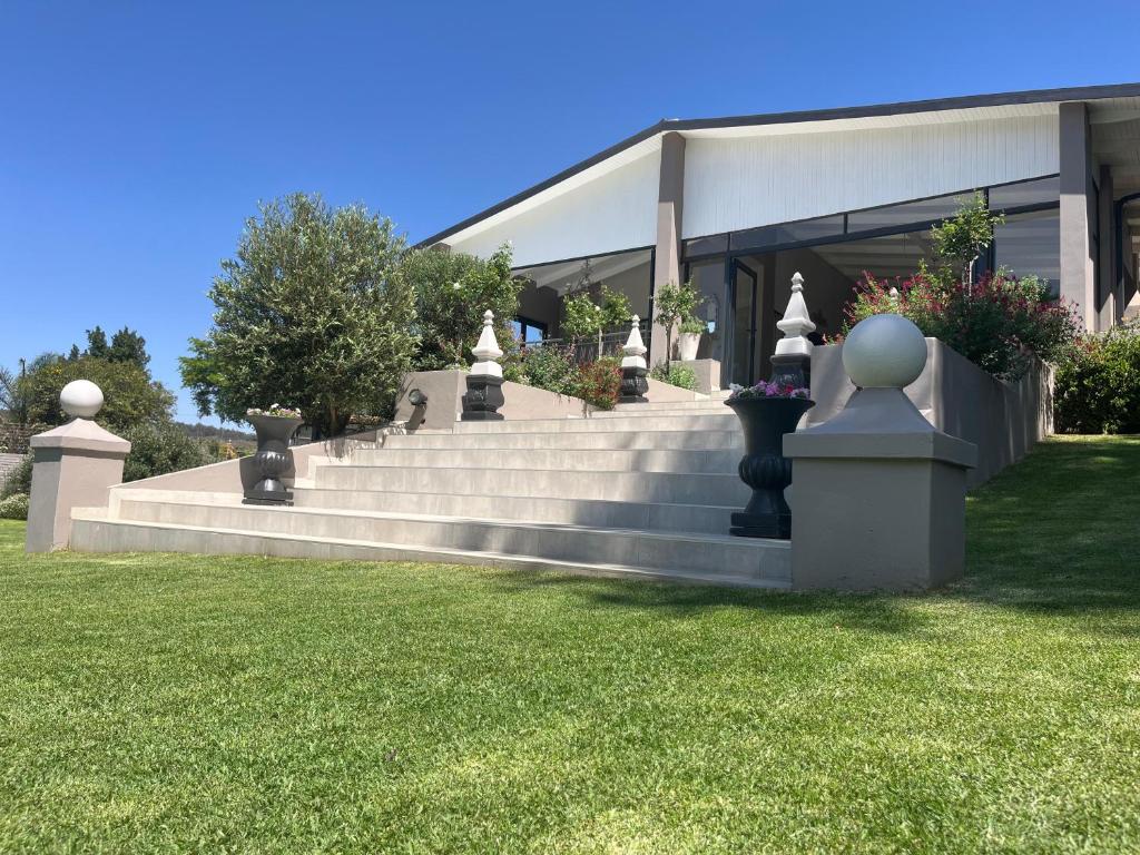 a building with stairs in front of a building at La Vida Luka - Luxury Guesthouse in Pretoria