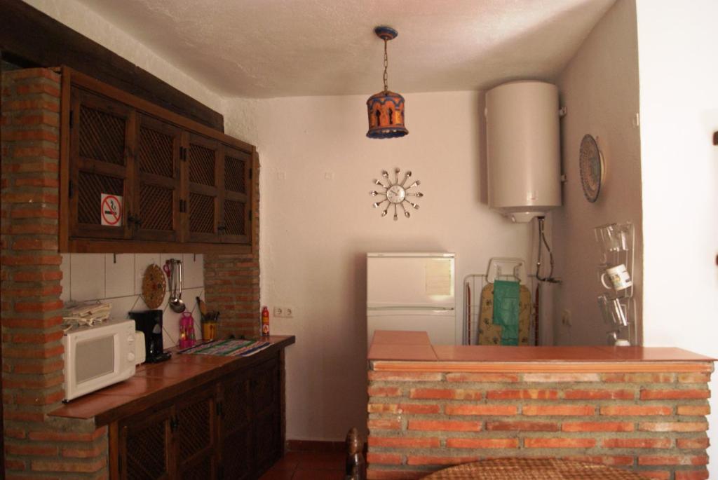 Kuchyň nebo kuchyňský kout v ubytování Cuevas de María