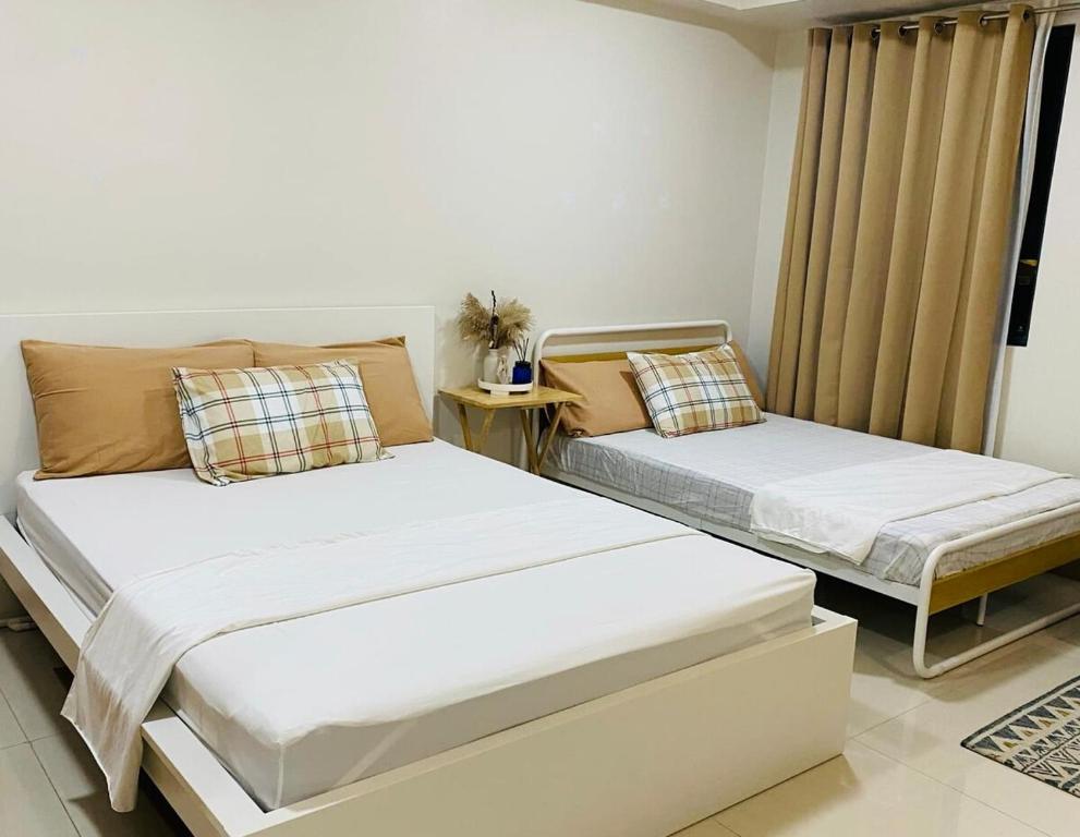 Postel nebo postele na pokoji v ubytování SM Style Residence Minimalist Condo Unitt