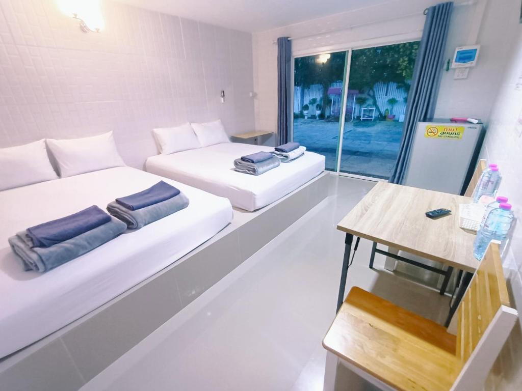 Postel nebo postele na pokoji v ubytování Saan Rak Resort