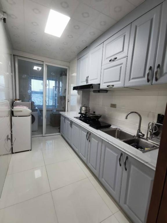 Kuchyň nebo kuchyňský kout v ubytování Yipinshiguang B&B