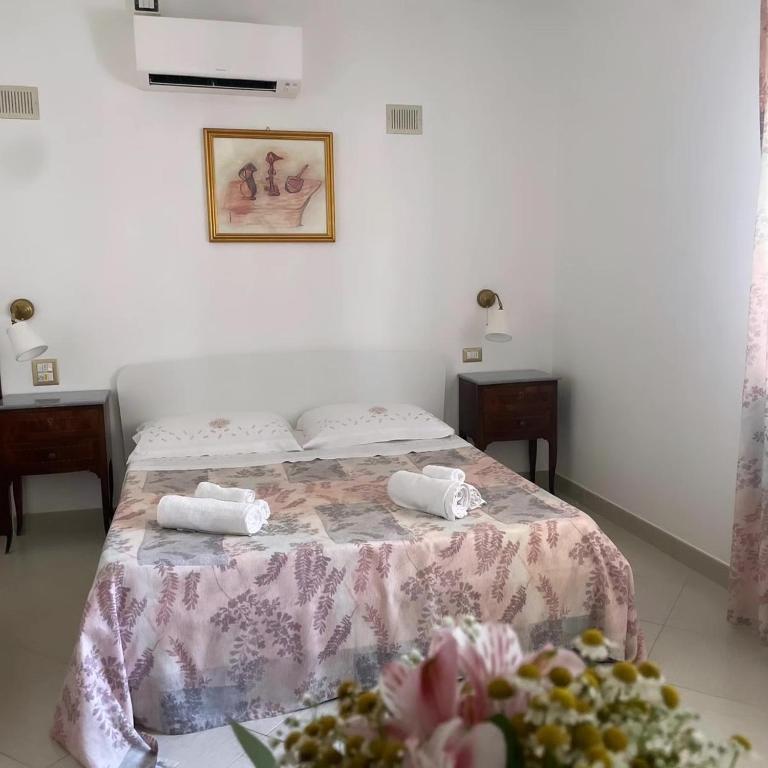 Postel nebo postele na pokoji v ubytování Gianmaria B&B