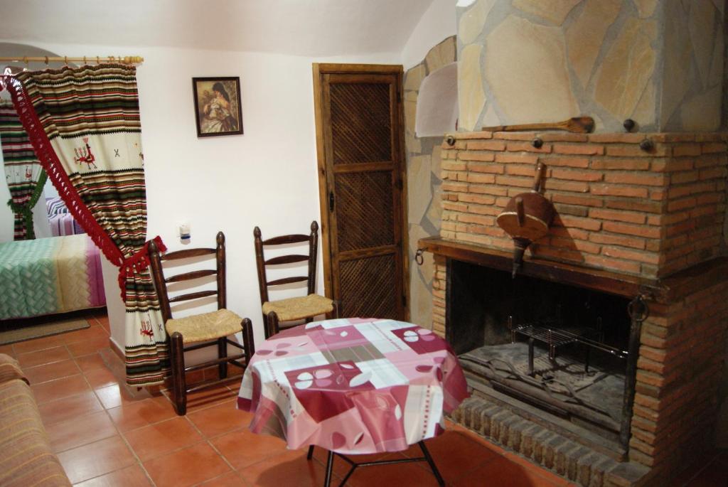 Posezení v ubytování Cuevas de María