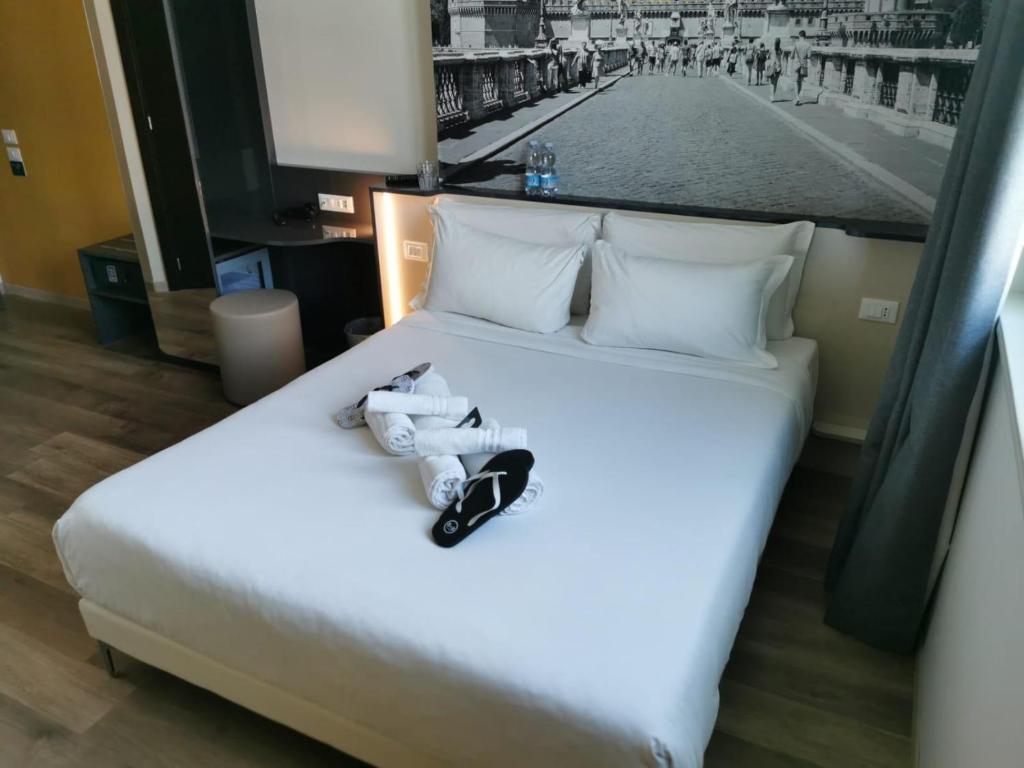 Postel nebo postele na pokoji v ubytování B&B Hotel Roma Fiumicino Aeroporto Fiera 1