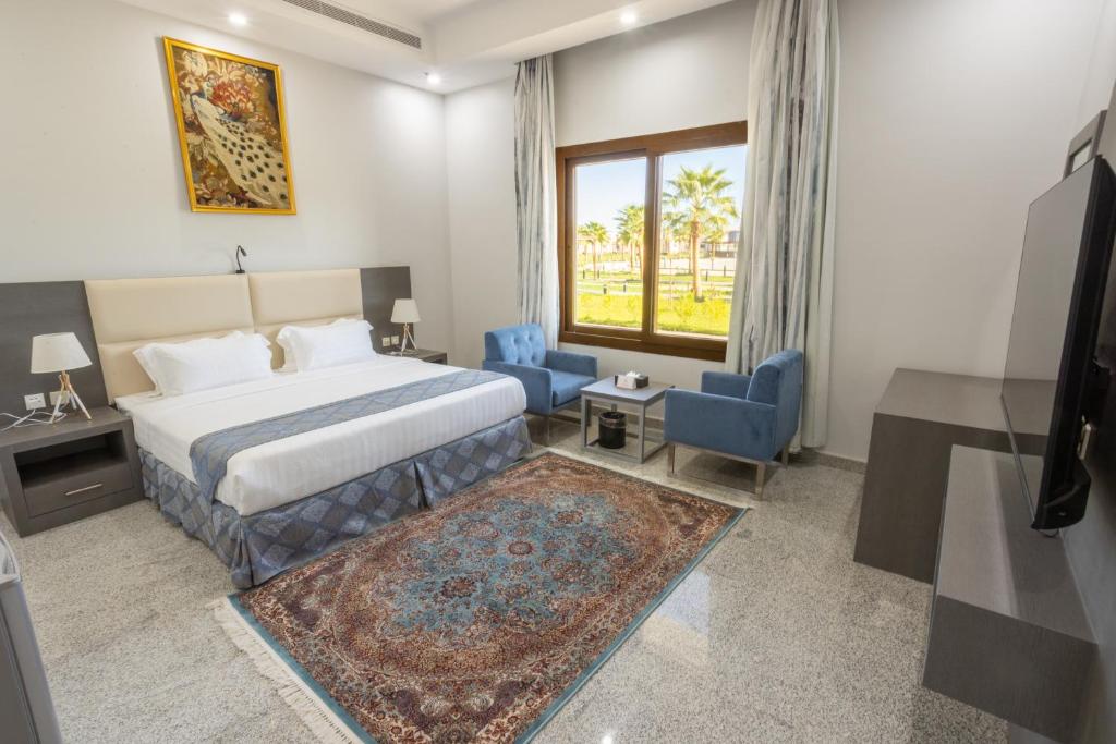 Postel nebo postele na pokoji v ubytování Vista Hotel Tabuk